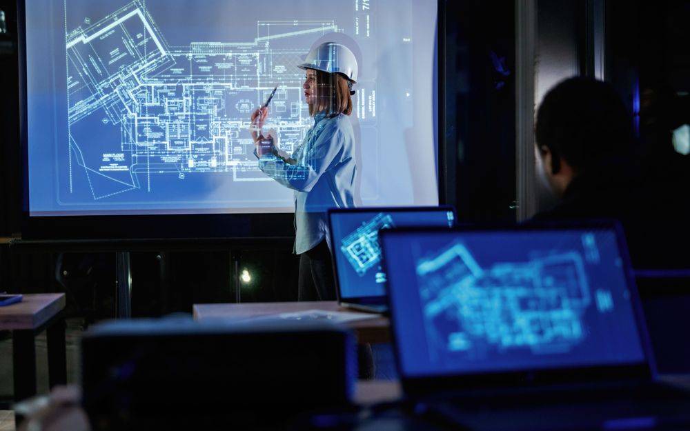 A woman holding a tablet inspects a data centre
