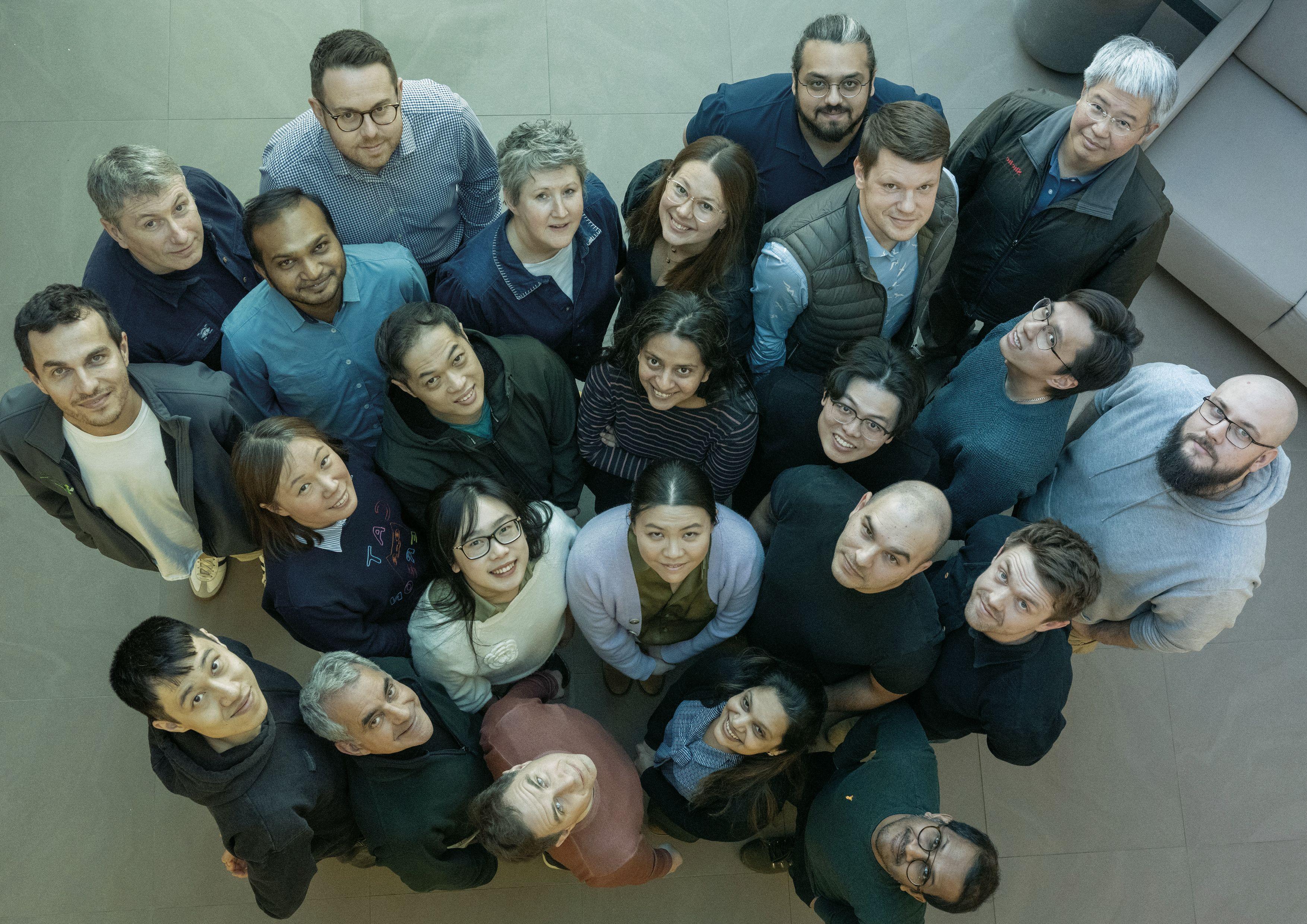 a group of people of different races look up